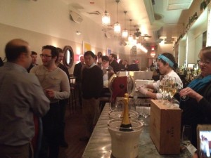 Dinner guests enjoying Krug NV Champagne before dinner